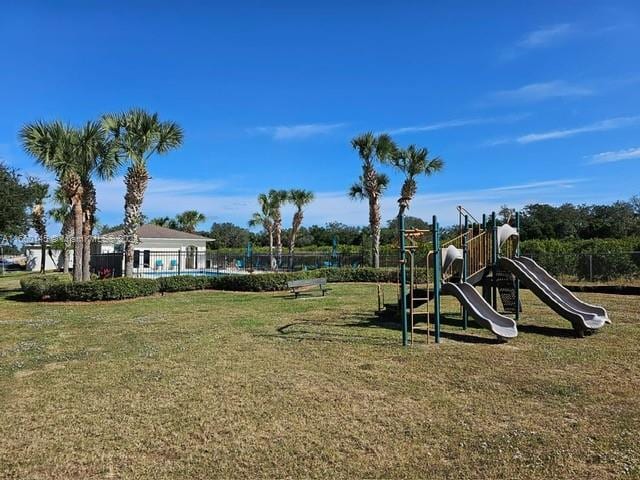 view of jungle gym with a yard