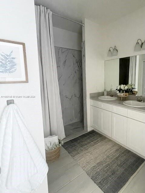 bathroom with vanity and walk in shower