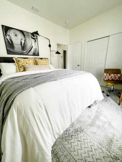 carpeted bedroom featuring a closet