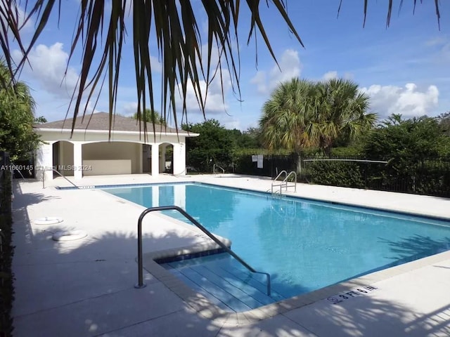 view of pool featuring a patio