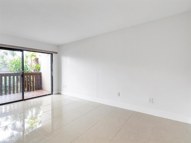 spare room with light tile patterned floors