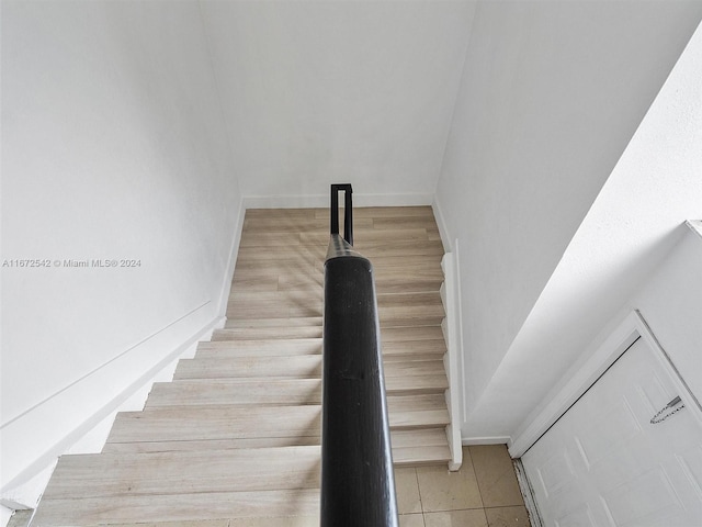 staircase with tile patterned flooring