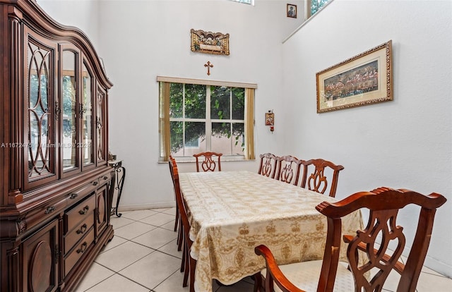 dining space featuring light tile patterned flooring and plenty of natural light