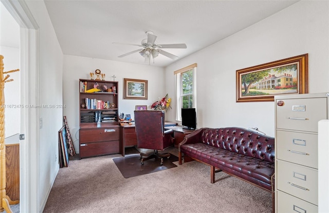 office space with light carpet and ceiling fan