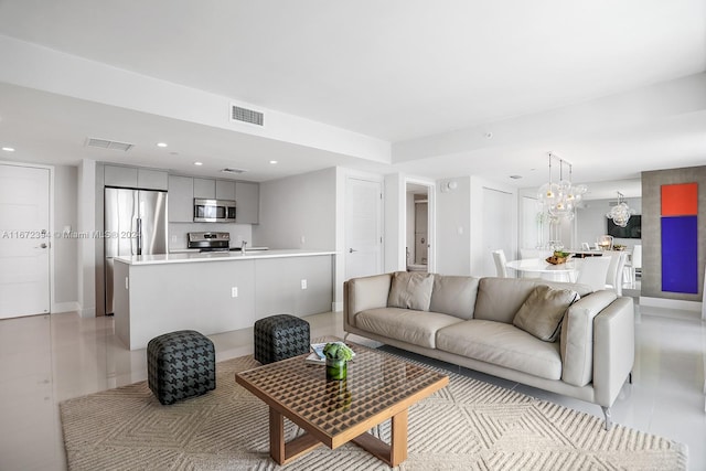 living room featuring a chandelier