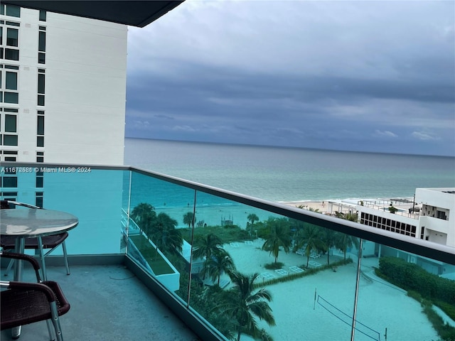 balcony featuring a water view