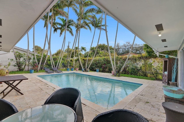 view of swimming pool with a patio