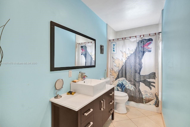 full bathroom featuring shower / bath combo with shower curtain, tile patterned floors, toilet, and vanity