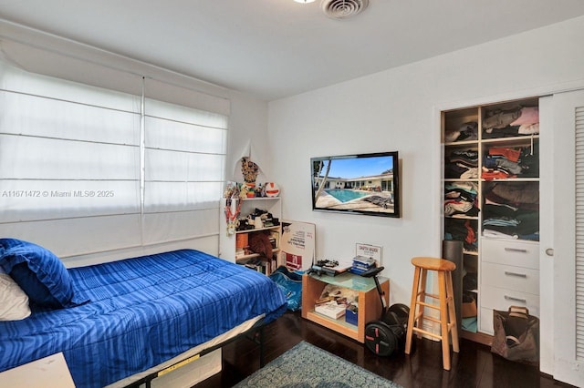 bedroom featuring hardwood / wood-style flooring and a closet