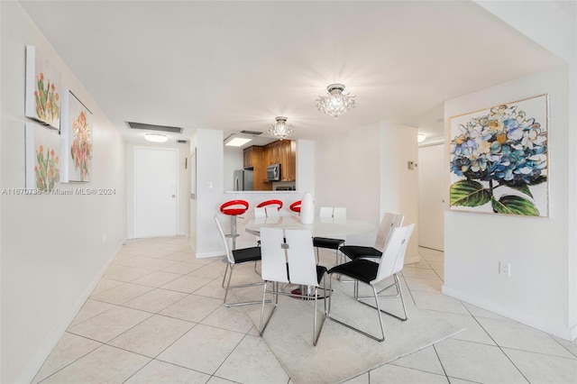 dining area featuring ceiling fan and light tile patterned floors