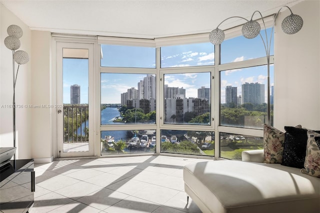 sunroom / solarium with a water view