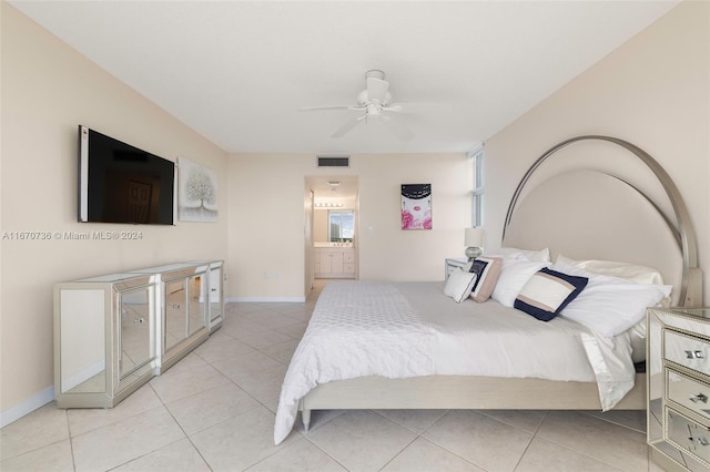 tiled bedroom with ceiling fan and ensuite bathroom