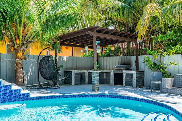 view of swimming pool with a pergola, area for grilling, a patio area, and grilling area