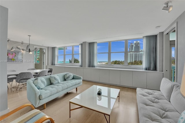 living room with light hardwood / wood-style flooring and plenty of natural light