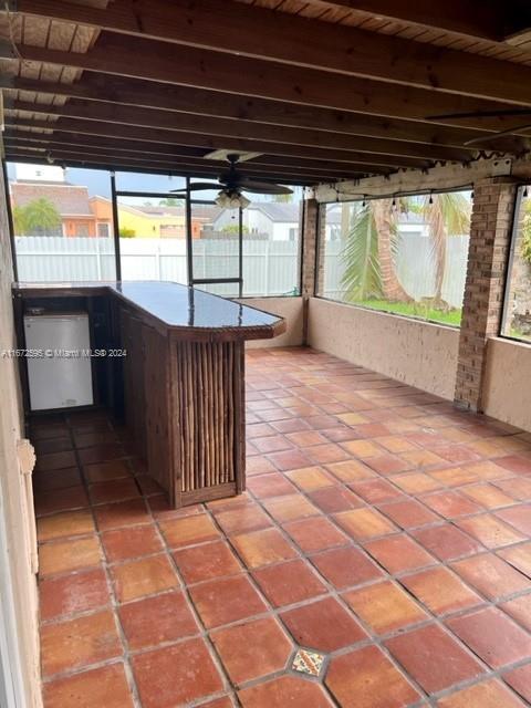 unfurnished sunroom with wooden ceiling