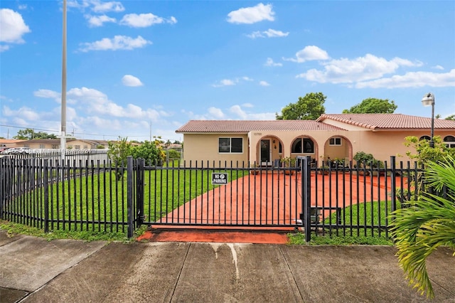 view of front of home with a front lawn