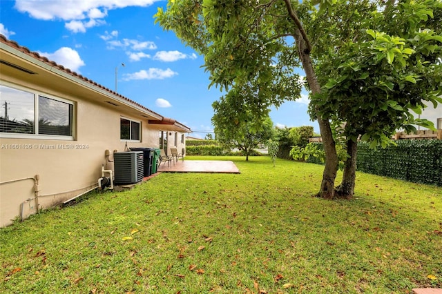 view of yard with a patio area and central air condition unit