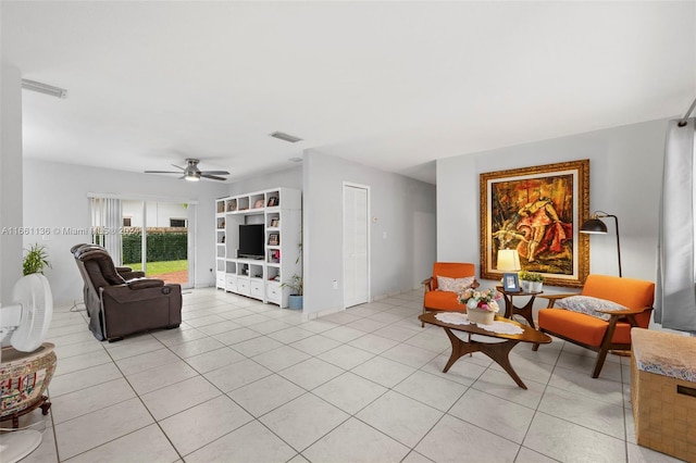 living room featuring light tile patterned flooring and ceiling fan