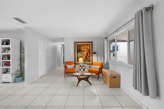 sitting room featuring light tile patterned floors