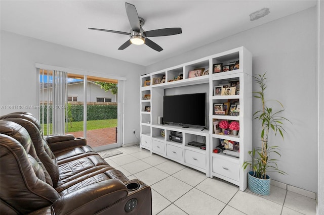 tiled living room with ceiling fan