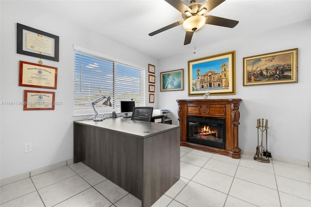 office area with ceiling fan and light tile patterned floors