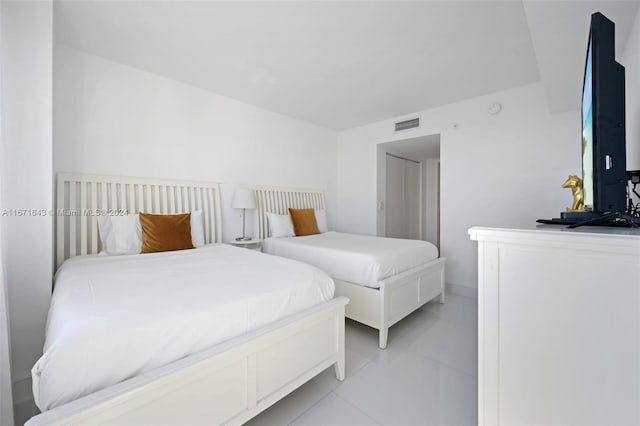 bedroom with light tile patterned flooring