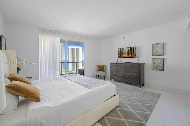 bedroom with light tile patterned floors