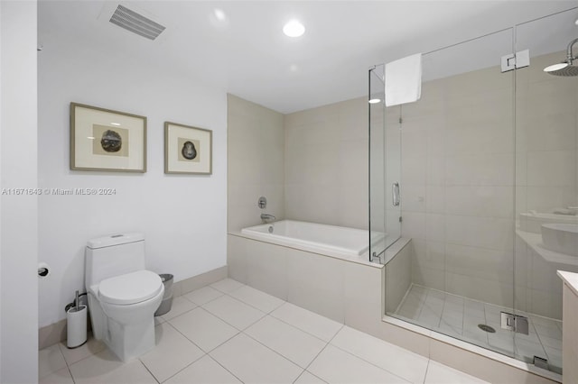 full bathroom featuring shower with separate bathtub, tile patterned flooring, vanity, and toilet