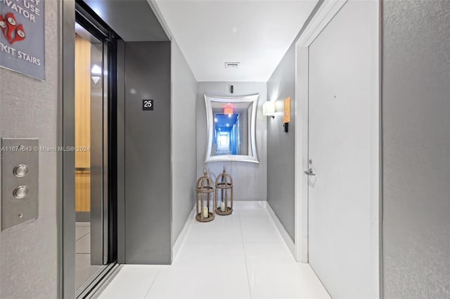 hall with light tile patterned flooring