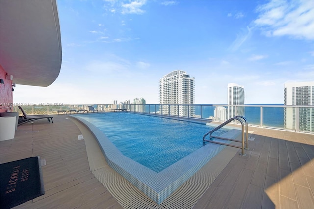 view of pool with a water view