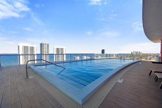 view of pool featuring a water view