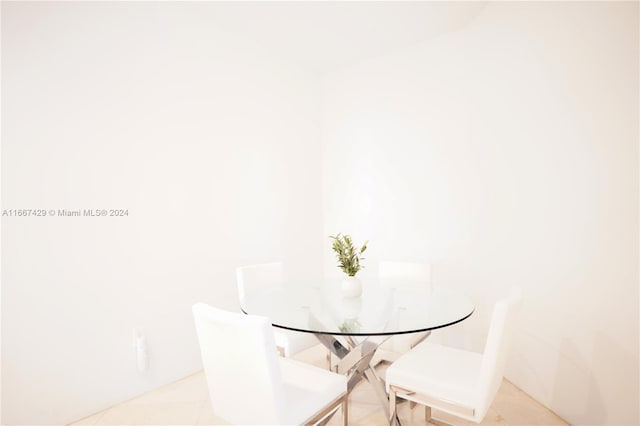 unfurnished dining area featuring light tile patterned floors