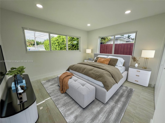 bedroom with light hardwood / wood-style floors