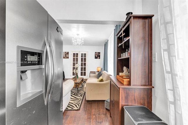 interior space featuring french doors, dark wood-type flooring, and a notable chandelier