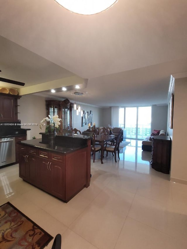 kitchen with dark brown cabinets, dishwasher, and light tile patterned flooring