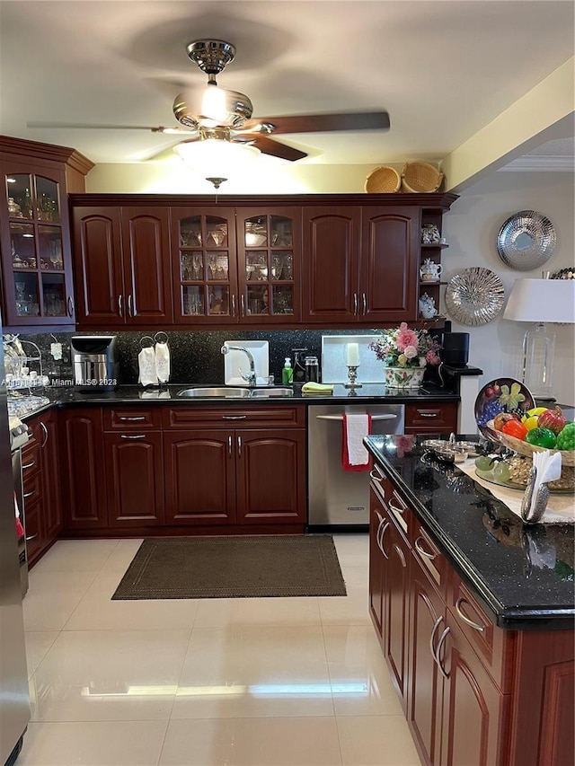 kitchen with backsplash, stainless steel dishwasher, sink, and light tile patterned floors