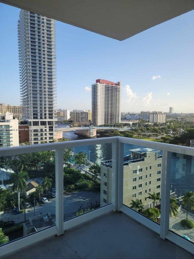 balcony featuring a water view