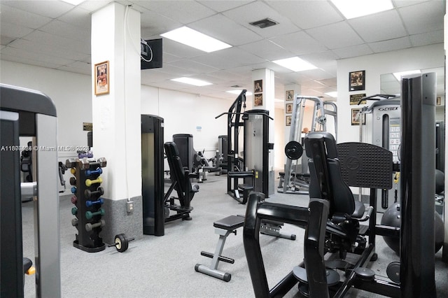 exercise room with a drop ceiling