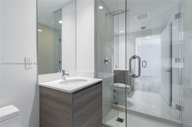 121 NE 34th St Unit 2806A, Miami, FL 33137 - full bath featuring a shower stall, toilet, and vanity
