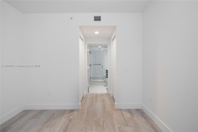 corridor featuring light hardwood / wood-style flooring