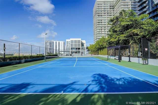 121 NE 34th St Unit 2806A, Miami, FL 33137 - view of sport court featuring fence and a pergola