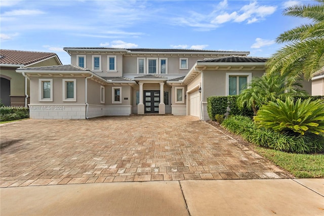 view of front of property with a garage