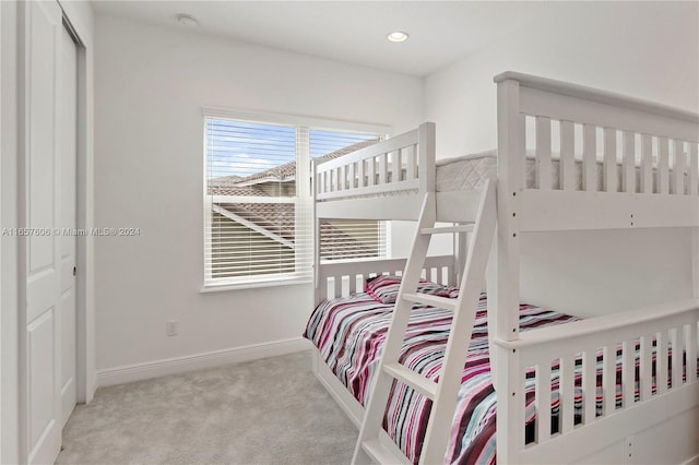 carpeted bedroom with a closet