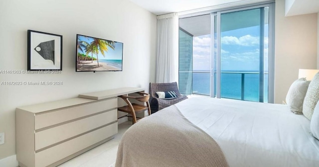 bedroom featuring multiple windows and access to outside