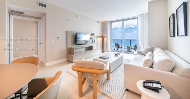4111 S Ocean Dr Unit 3007, Hollywood, FL 33019 - living area featuring floor to ceiling windows, light tile patterned floors, and visible vents