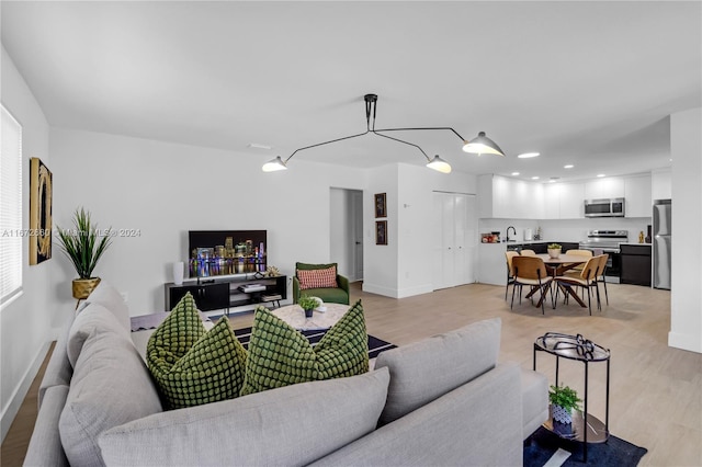 living room with light hardwood / wood-style floors