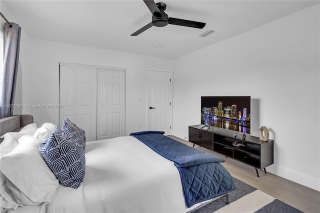 bedroom featuring light wood-type flooring and ceiling fan