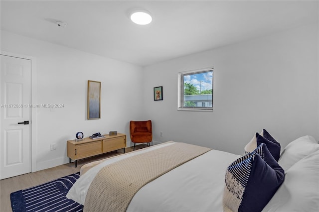 bedroom with wood-type flooring