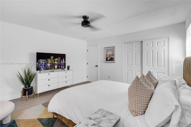 bedroom featuring wood-type flooring and ceiling fan