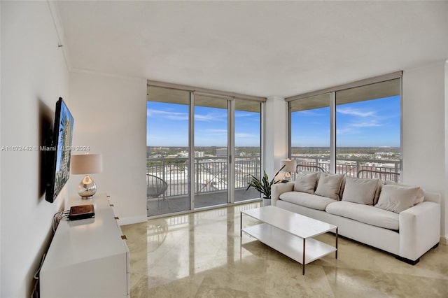 living room with expansive windows, a wealth of natural light, and ornamental molding